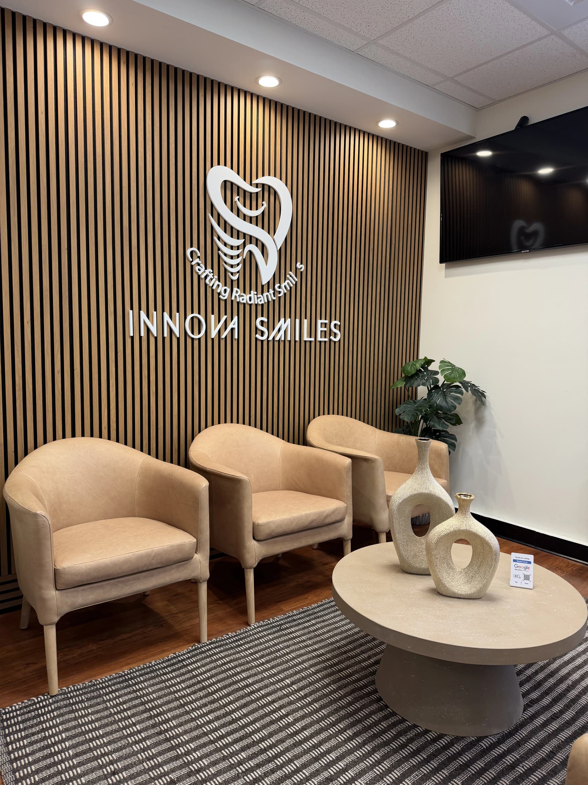 Warm, modern waiting room lobby at Innova Smiles in Marlborough, MA