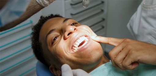 Topical anesthetic gel and applicator prepared for treatment.