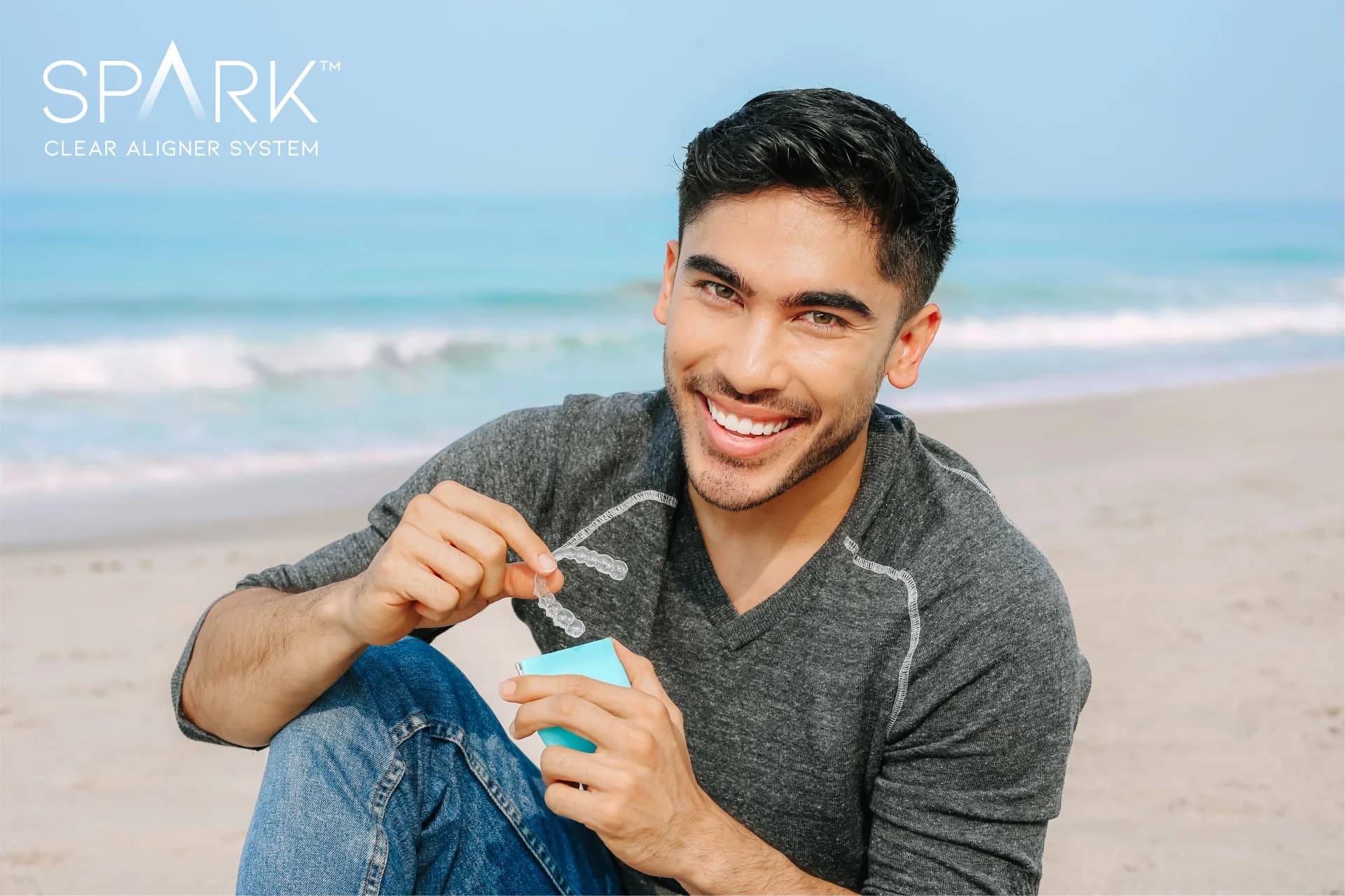 Person wearing virtually invisible Spark clear aligners