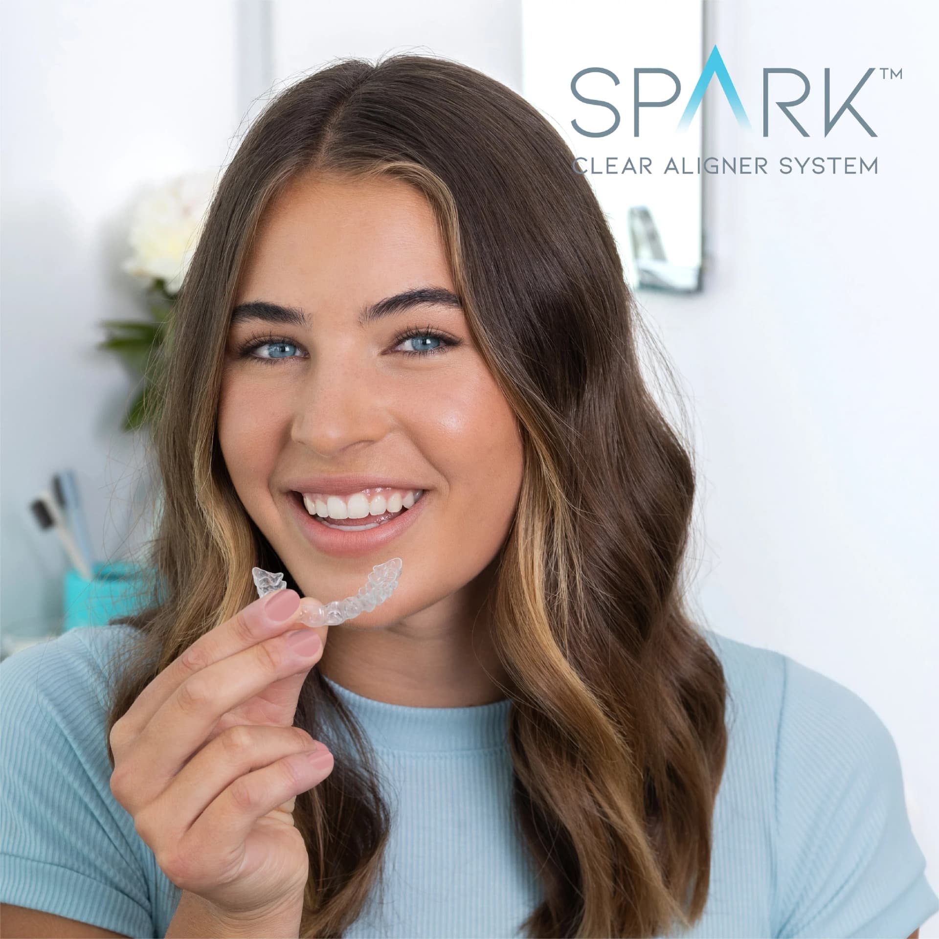 Clear aligner patient Dani celebrating her graduation smile at Innova Smiles